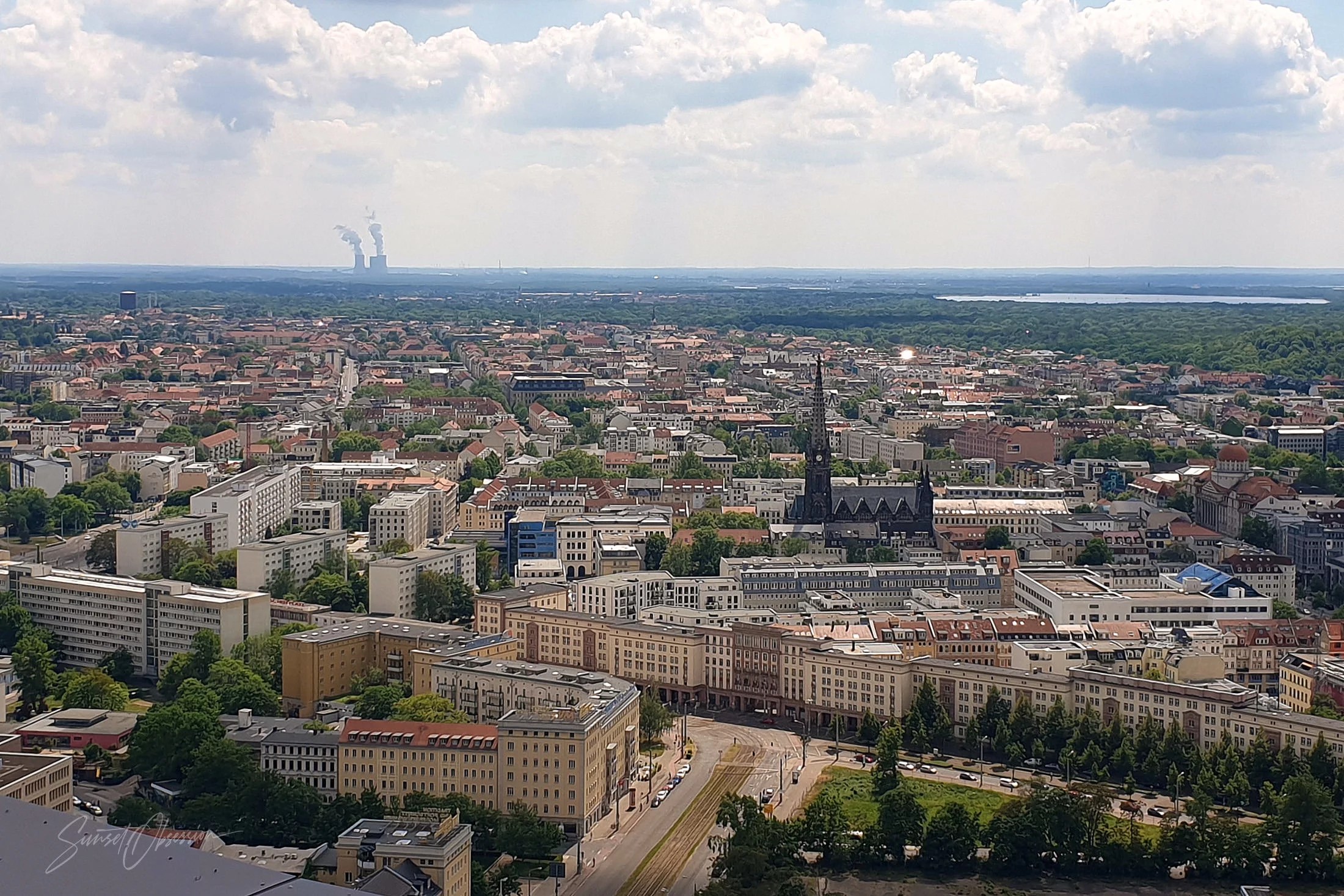 Contrasts of Leipzig are easily visible from the Panorama Tower: steaming factory and gothic church in one frame