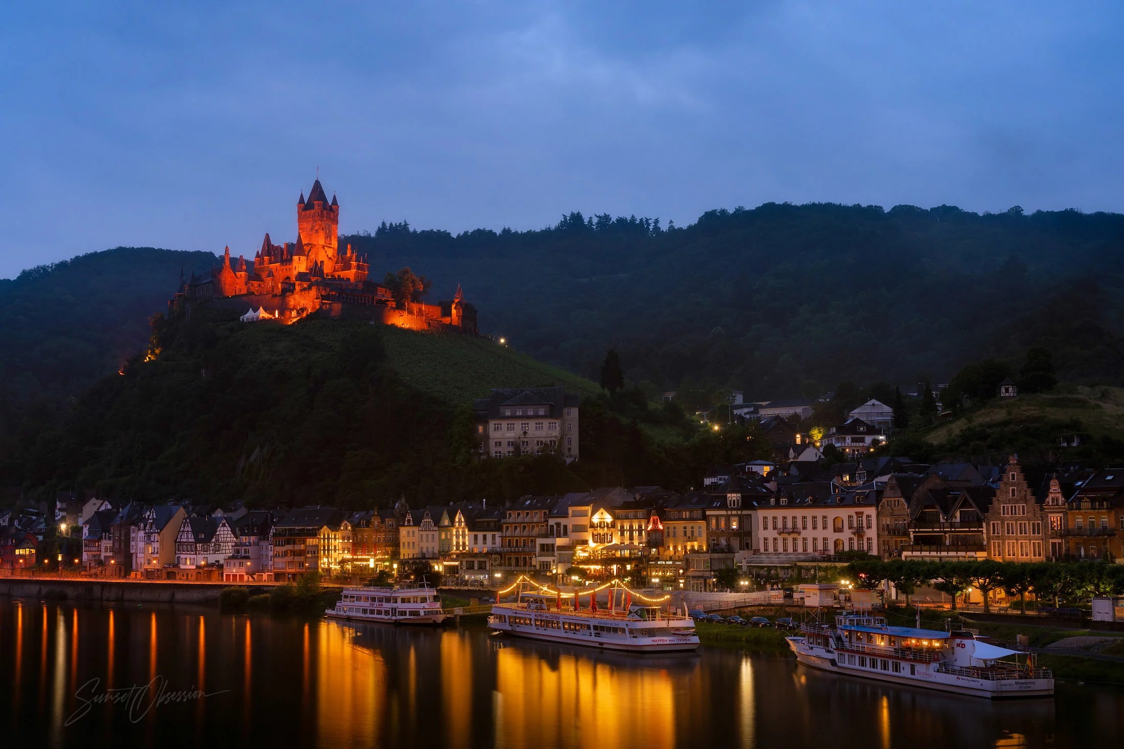 Town of Cochem and its castle in the early night light