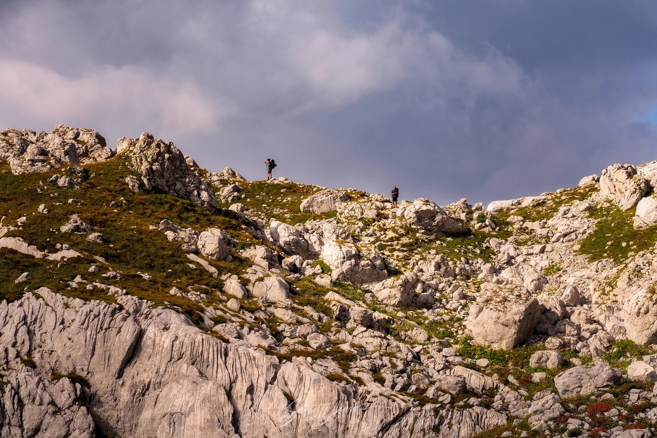 Hikers on the Seven Lakes Valley hike in Julian Alps in Slovenia