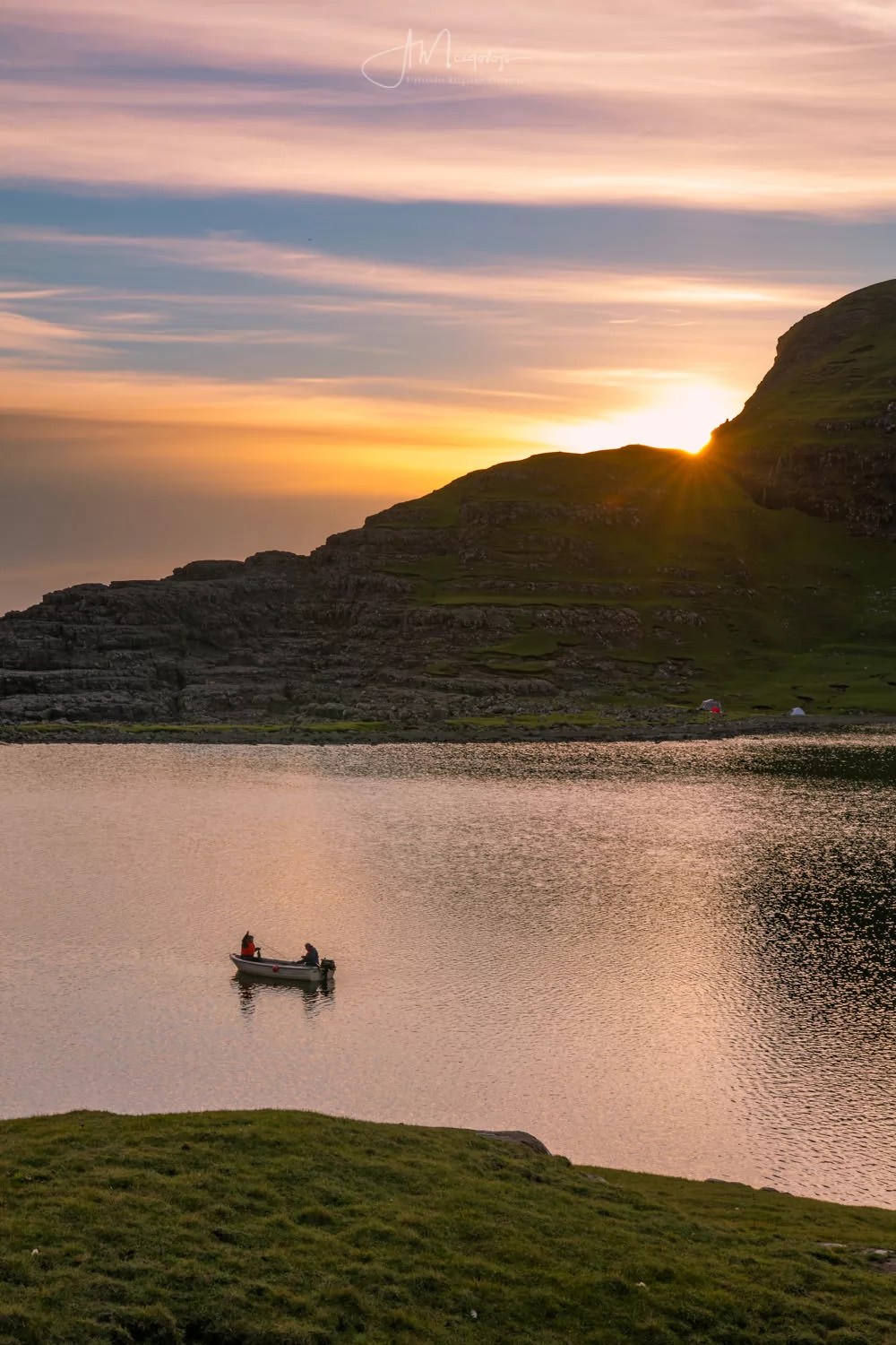 Firshermen at lake Sørvagsvatn during sunset, island of Vagar, Faroe Islands
