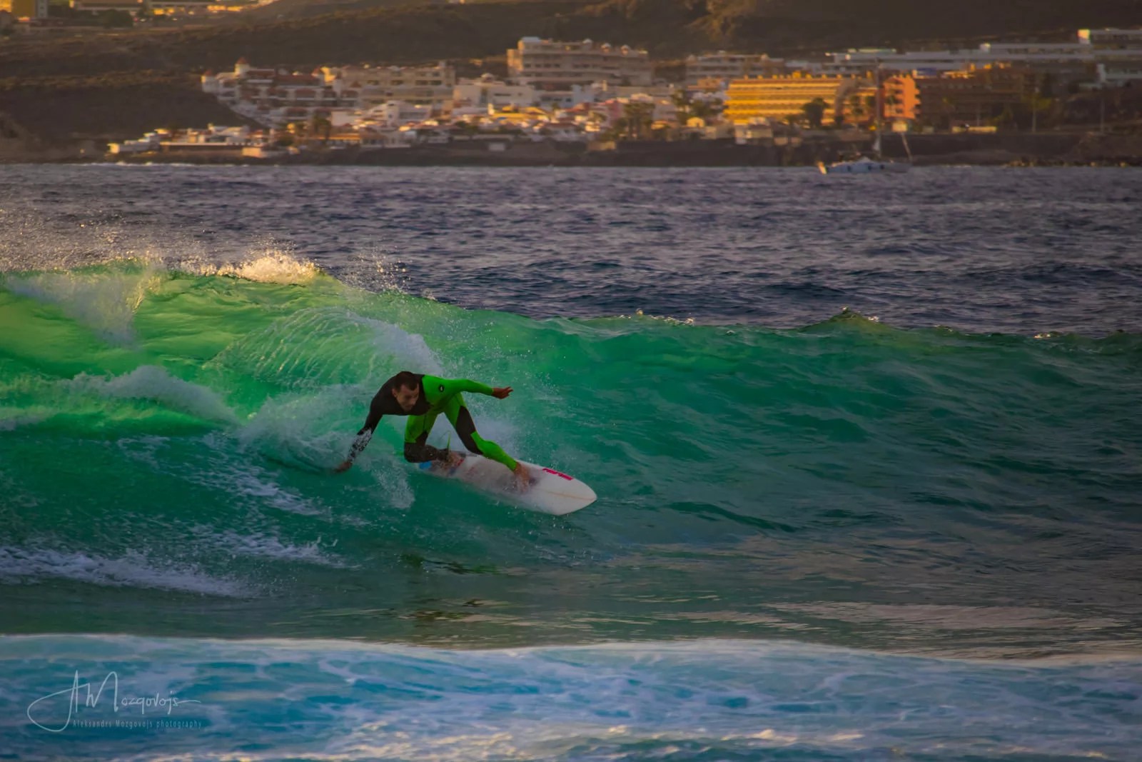 A surfer at Las Americas beach in Tenerife, Canary Islands