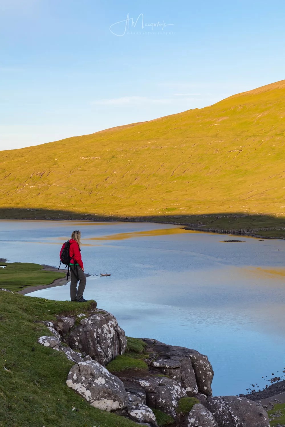 Taking a break on the hike to Trælanípa on the island of Vagar, Faroe Islands