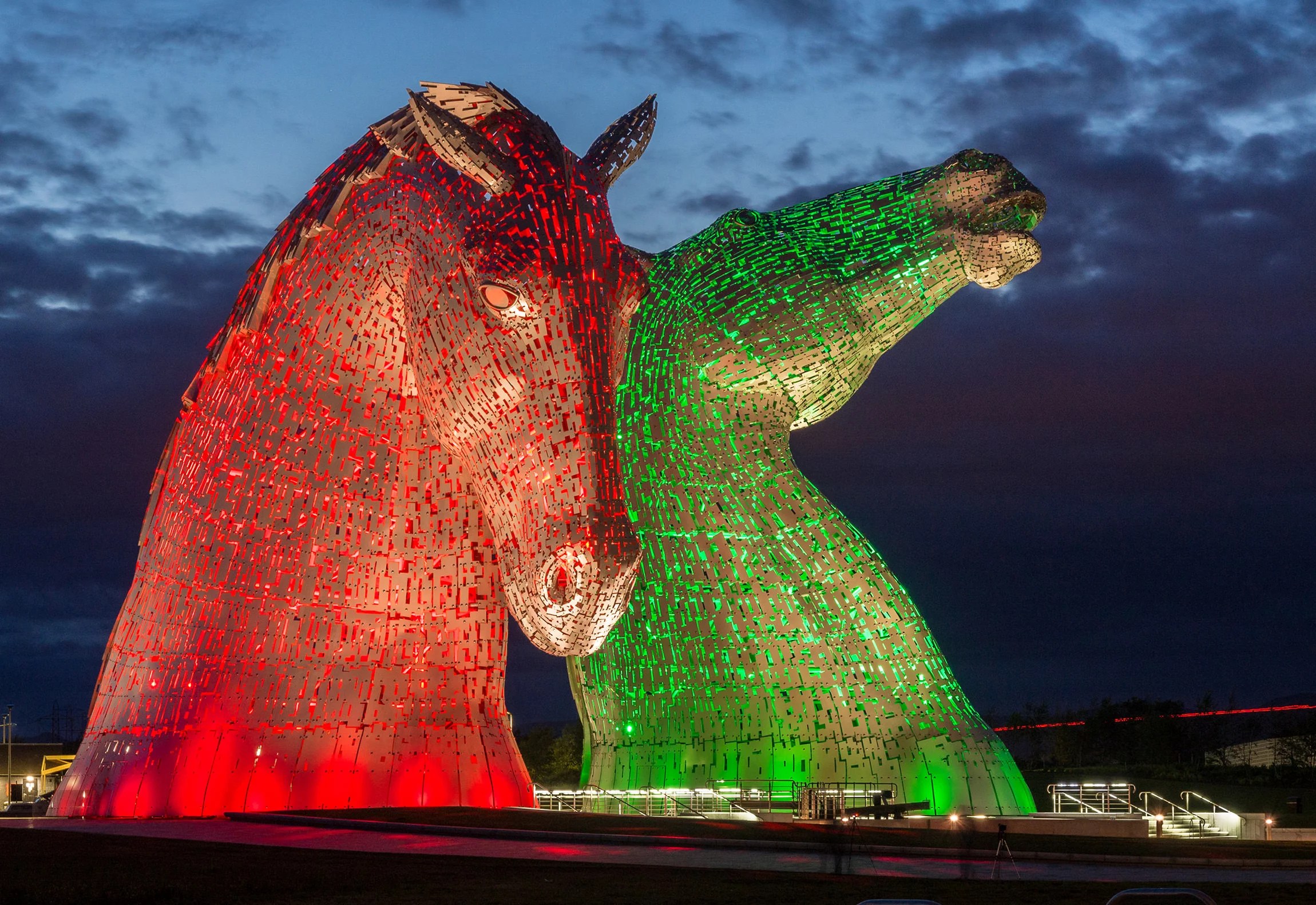 The Kelpies illuminated at night